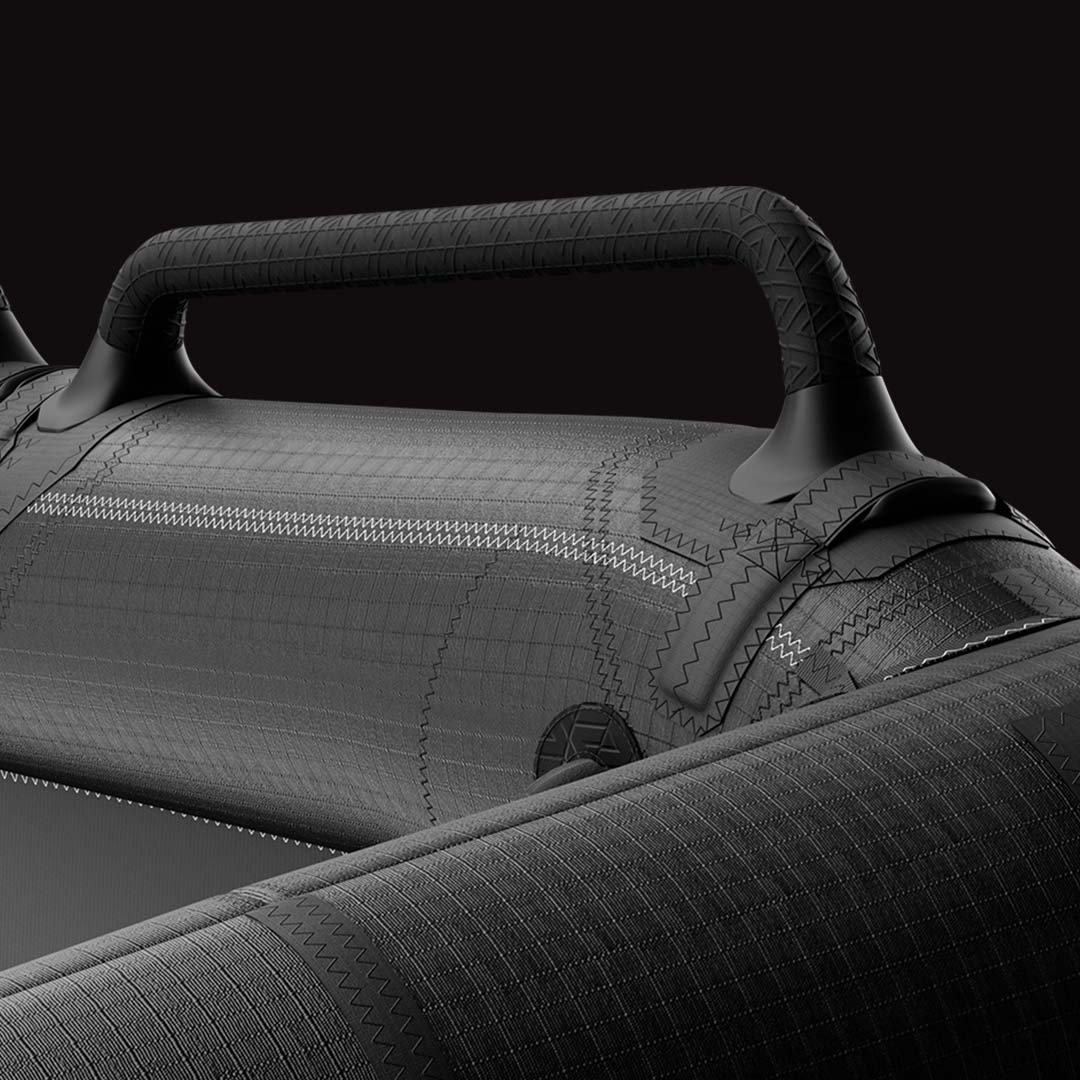 Vue de profil des poignées carbone hybrides Armstrong installées sur une aile de wingfoil pliée